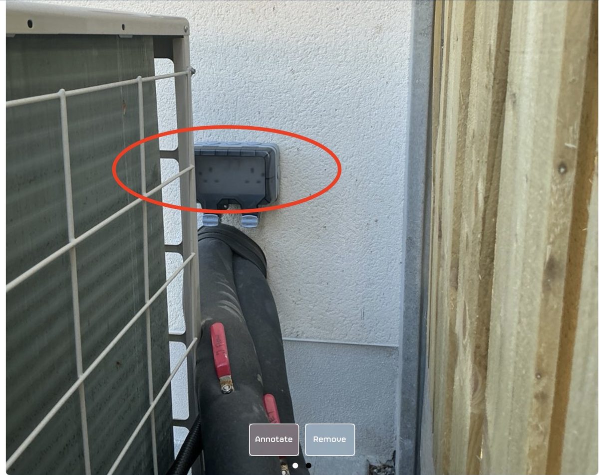 External electrical socket box on rear elevation of new build flagged for incorrect position